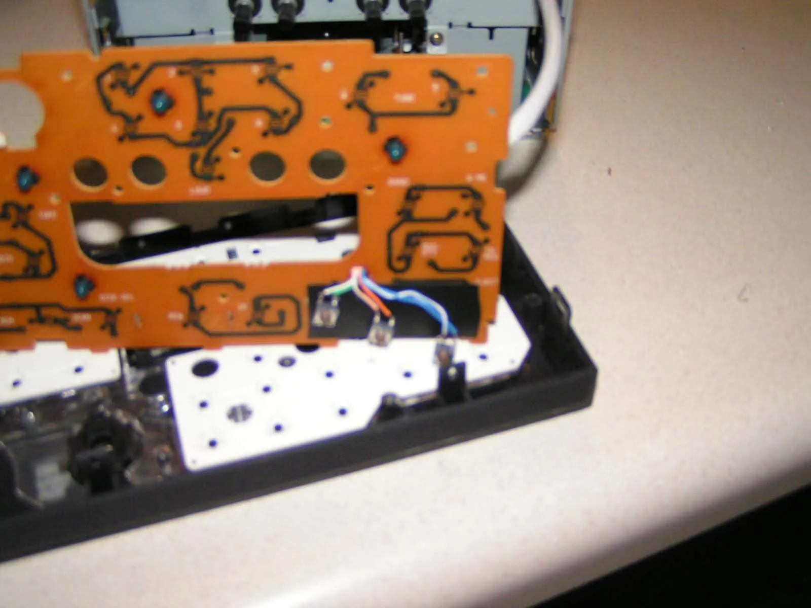 Added three microswitch pushbottons behind the faceplate on the head unit