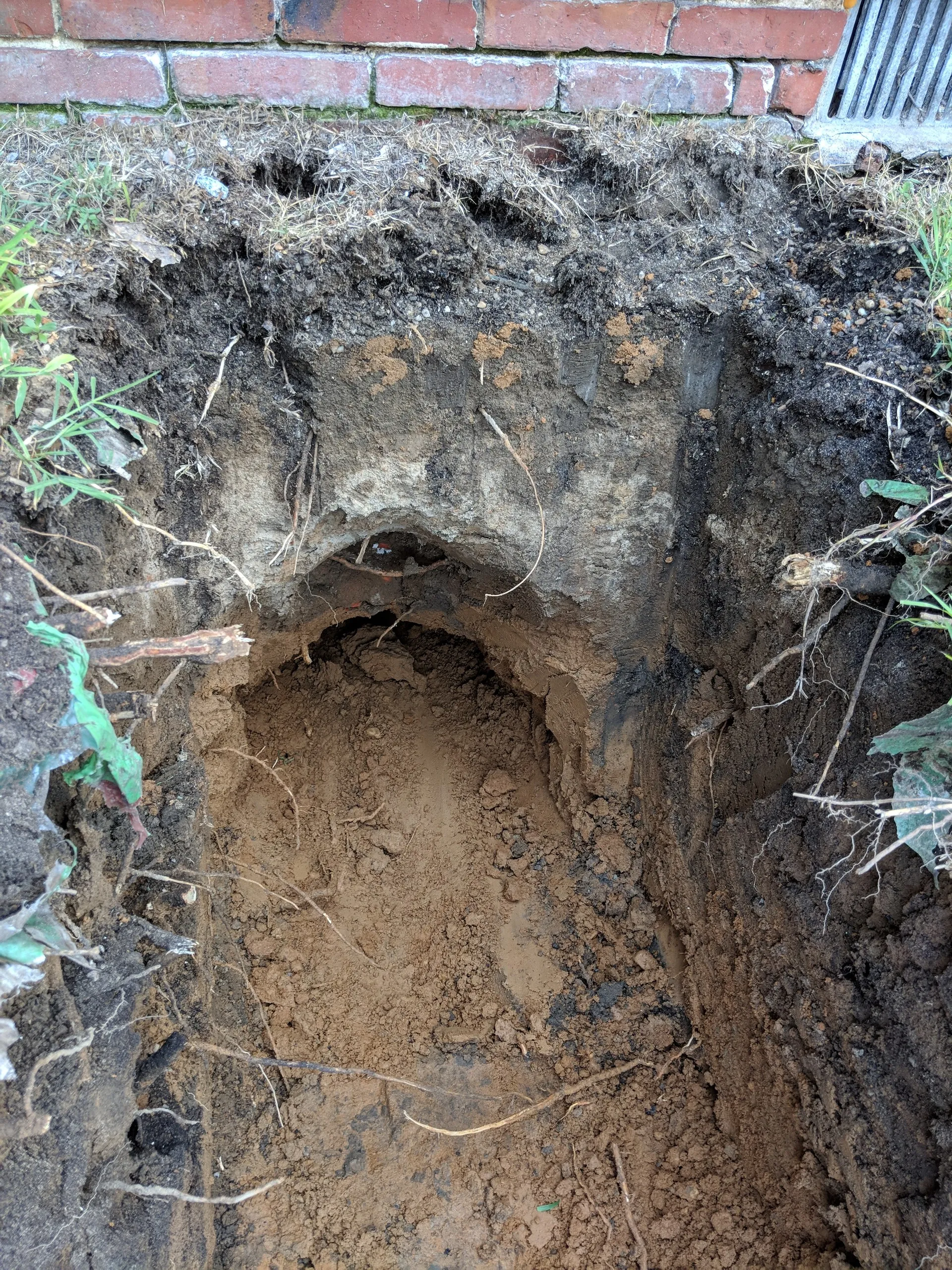 Digging under the foundation for interconnect piping