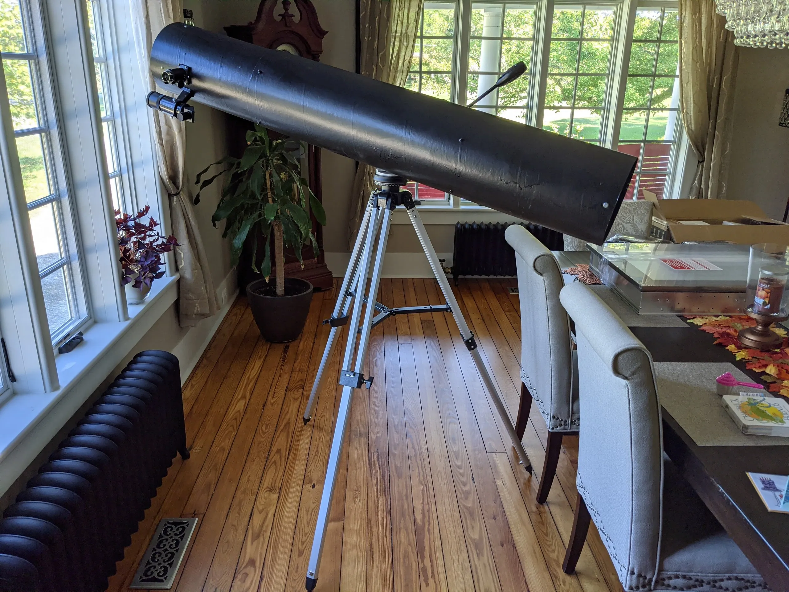 The finished telescope, painted black, on its photo tripod indoors