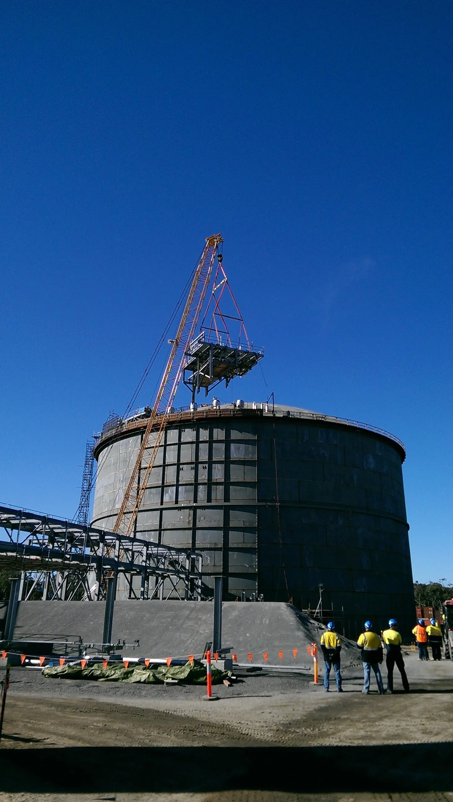 Lifting the pump platform the top of the tank