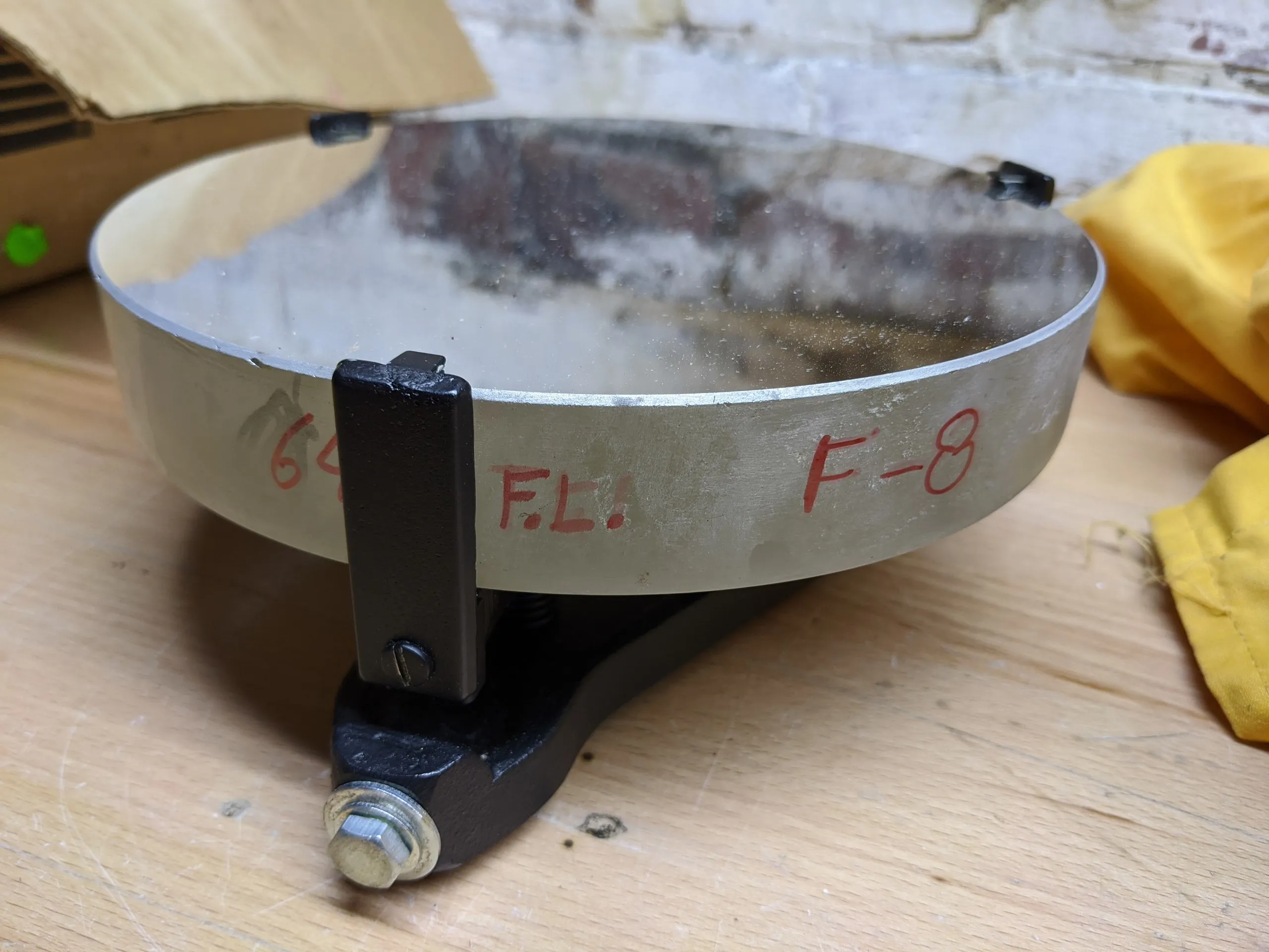 Close-up of the primary mirror’s edge, hand-marked with its focal length and f-ratio